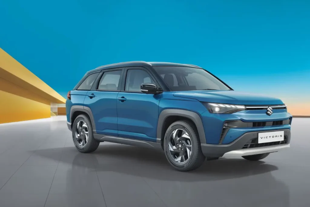 Victoris vs Seltos Base Model: Which SUV Makes More Sense? 1 Maruti Suzuki Victoris base variant parked in studio setting showing front design and alloy-style wheels