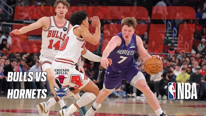 Major: 5 Key Things to Know About Bulls Hornets Last Game... 2 Charlotte Hornets guard dribbles past two Chicago Bulls defenders during an intense NBA matchup at a packed arena.